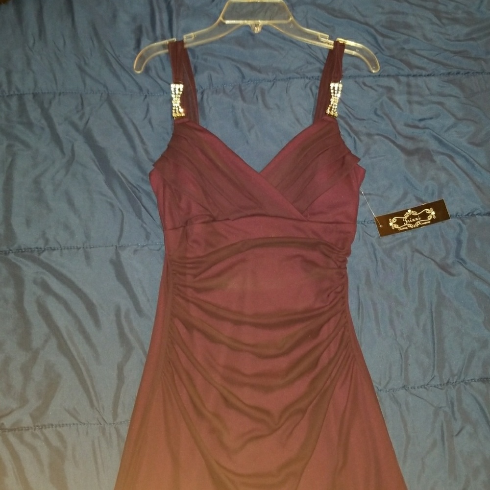 Red dress with jewels on the strap. Looks nice.